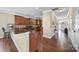Open kitchen featuring wood cabinets, hardwood floors, and stainless steel appliances at 4016 Garden Oak Dr, Indian Trail, NC 28079