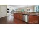 Open-concept kitchen with stainless appliances, granite countertops, and seamless flow to living area at 4016 Garden Oak Dr, Indian Trail, NC 28079