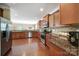 Well-equipped kitchen with hardwood floors, granite countertops, and stainless steel appliances at 4016 Garden Oak Dr, Indian Trail, NC 28079