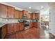 Kitchen featuring granite countertops, wood cabinets, stainless steel appliances, and hardwood floors at 4016 Garden Oak Dr, Indian Trail, NC 28079