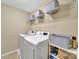 Functional laundry room with modern washer and dryer, wire shelving for storage at 4016 Garden Oak Dr, Indian Trail, NC 28079