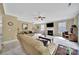 Spacious living room with fireplace, ceiling fan and large windows allowing ample natural light at 4016 Garden Oak Dr, Indian Trail, NC 28079