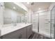 Contemporary bathroom featuring a double vanity, walk-in shower, and ample space at 4225 Summit Woods Dr, Charlotte, NC 28216