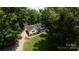 Aerial view showcases the charming home, detached garage, and well-maintained lawn at 432 Partridge Pl, York, SC 29745