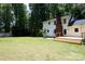 The spacious backyard has a new wooden deck with steps and a brick fire pit at 432 Partridge Pl, York, SC 29745