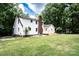 The backyard features an expansive lawn, new wood deck, and stone fire pit at 432 Partridge Pl, York, SC 29745