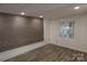 Finished basement with wood-look floors, paneled walls and bright window at 432 Partridge Pl, York, SC 29745