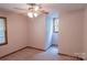This bedroom includes carpet flooring, a ceiling fan, and a window for natural light at 432 Partridge Pl, York, SC 29745
