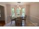 Bright dining area featuring a bay window and a wooden table with seating for four at 432 Partridge Pl, York, SC 29745