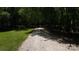 Long, gravel driveway leading through a canopy of trees at 432 Partridge Pl, York, SC 29745
