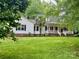 Charming single Gathering home featuring a lush lawn and an inviting front porch at 432 Partridge Pl, York, SC 29745