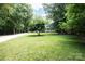 Spacious front yard with lush lawn and mature trees surrounding the property at 432 Partridge Pl, York, SC 29745
