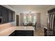 Eat-in kitchen with bay window overlooking the backyard and white countertops with navy cabinets at 432 Partridge Pl, York, SC 29745