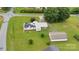 Aerial view of a well-maintained home featuring solar panels, a metal roof, and a large, grassy yard at 543 18Th Nw St, Hickory, NC 28601