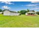 Expansive backyard showcasing a detached three-car garage and the rear elevation of the charming single-story home at 543 18Th Nw St, Hickory, NC 28601