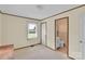 Bedroom leading to bathroom with window and carpet flooring at 543 18Th Nw St, Hickory, NC 28601
