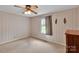 Comfortable bedroom with vintage wallpaper, carpet, and ample natural light at 543 18Th Nw St, Hickory, NC 28601