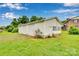 Detached three-car garage with white siding, providing ample storage and parking space in the property's backyard at 543 18Th Nw St, Hickory, NC 28601