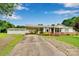 Charming single-story home featuring a brick foundation, covered carport, and detached garage with ample parking space at 543 18Th Nw St, Hickory, NC 28601