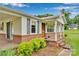 Inviting front porch with brick accents, providing a cozy entrance to the charming single-story home at 543 18Th Nw St, Hickory, NC 28601