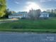Charming single-story home with covered parking and a lush, green lawn at 543 18Th Nw St, Hickory, NC 28601