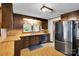 Charming kitchen featuring wood cabinets, wood-look counters and black appliances at 543 18Th Nw St, Hickory, NC 28601