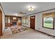 Comfortable living room with a brick fireplace, built-in cabinetry, carpeted floors and a floral rug at 543 18Th Nw St, Hickory, NC 28601
