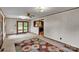Cozy living room featuring wood trim, paneled walls, ceiling fan and sliding glass doors to outdoor living at 543 18Th Nw St, Hickory, NC 28601