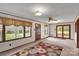 Bright living room showcasing large windows, wood trim, paneled walls and floral area rug at 543 18Th Nw St, Hickory, NC 28601