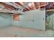 Spacious unfinished basement with brick walls, offering ample space for storage or future customization at 6447 E Nc 27 Hwy, Iron Station, NC 28080