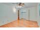 Bedroom featuring ceiling fan, closet, hardwood floors, and neutral walls at 6447 E Nc 27 Hwy, Iron Station, NC 28080