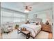Inviting bedroom with comfortable furnishings, natural light, and ceiling fan at 6447 E Nc 27 Hwy, Iron Station, NC 28080
