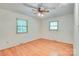 Bedroom featuring ceiling fan, hardwood floors, and white walls and trim at 6447 E Nc 27 Hwy, Iron Station, NC 28080