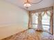 This room features large windows with ornate curtains, providing natural light and a view of the outside at 6447 E Nc 27 Hwy, Iron Station, NC 28080