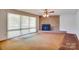 The living room features a stone fireplace and large windows, creating a warm and inviting atmosphere at 6447 E Nc 27 Hwy, Iron Station, NC 28080