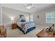 Bedroom with carpet, ceiling fan, two windows with shutters, and traditional-style furnishings at 6824 N Baltusrol Ln, Charlotte, NC 28210