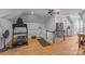 Spacious bonus room featuring hardwood floors, exercise equipment, ceiling fan and staircase at 6824 N Baltusrol Ln, Charlotte, NC 28210