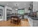 Modern kitchen with stainless steel appliances, island with seating, and ample cabinet space for a chef's dream at 6824 N Baltusrol Ln, Charlotte, NC 28210