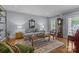 Bright living room showcasing neutral paint, hardwood floors, and classic furnishings in a comfortable setting at 6824 N Baltusrol Ln, Charlotte, NC 28210
