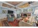 Inviting living room with a brick fireplace, plush seating, and sophisticated decor for comfortable living at 6824 N Baltusrol Ln, Charlotte, NC 28210