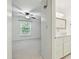 Bright bathroom with modern sink and cabinet and tiled shower at 7004 Quail Hill Rd, Charlotte, NC 28210
