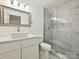 Modern bathroom featuring a glass shower and new fixtures at 7004 Quail Hill Rd, Charlotte, NC 28210