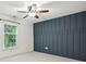 Bright bedroom with modern accent wall and natural light at 7004 Quail Hill Rd, Charlotte, NC 28210