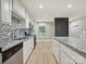 Bright kitchen with stainless appliances, granite countertops, and modern backsplash at 7004 Quail Hill Rd, Charlotte, NC 28210