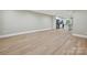Open living room and kitchen area with modern flooring and natural light at 7004 Quail Hill Rd, Charlotte, NC 28210