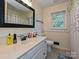 Well-maintained bathroom with natural light, offering a clean and functional space for everyday personal care routines at 8200 Lansford Rd, Charlotte, NC 28277