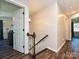 Bright hallway with a staircase, offering seamless transitions between floors and showcasing the home's layout and design at 8200 Lansford Rd, Charlotte, NC 28277
