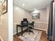 Functional home office space with hardwood floors, neutral walls, and a comfortable workspace for enhanced productivity at 8200 Lansford Rd, Charlotte, NC 28277