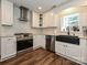 Features a black farmhouse sink, subway tile backsplash, and stainless steel appliances at 8200 Lansford Rd, Charlotte, NC 28277