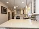 Bright kitchen with granite countertops, breakfast bar, and modern pendant lighting at 8200 Lansford Rd, Charlotte, NC 28277